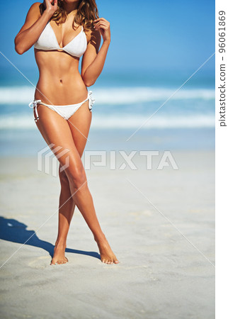 Her body was made for the beach. Cropped shot of a gorgeous woman in a bikini at the beach. 96061869