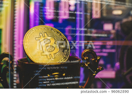 Cryptocurrency concept , Golden bitcoin on winners cup background mainboard , The future of money. Computational equipment. Cryptocurrency concept , Golden bitcoin on winners cup background mainboard , The future of money. Computational equipment. 96062890