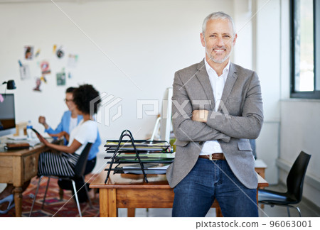 Ive got one of the best teams behind me. Portrait of a mature businessman standing in an office. Ive got one of the best teams behind me. Portrait of a mature businessman standing in an office. 96063001