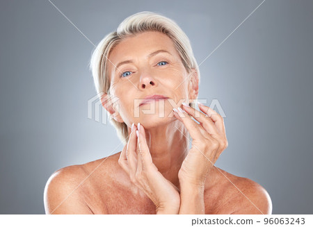 Senior woman, skincare and beauty of a model holding her healthy face ready for wellness and skin treatment. Portrait of a elderly person from Finland touching smooth body texture after dermatology Senior woman, skincare and beauty of a model holding her healthy face ready for wellness and skin treatment. Portrait of a elderly person from Finland touching smooth body texture after dermatology 96063243