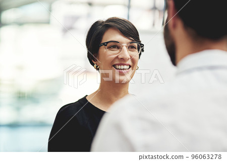 Sharing some positive news. Cropped shot of a businesswoman having a discussion with a colleague in an office. 96063278