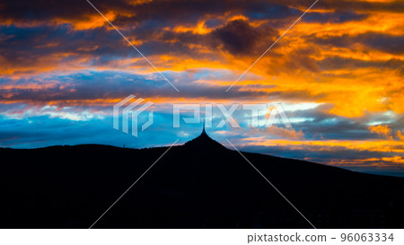 Silhouette of Jested mountain with dramatic cloudscape at sunset time, Liberec, Czech Republic 96063334