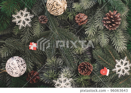 Happy New Year holiday concept. New Year decorations, tree, snowflake, pine cone, gifts on background. Holiday party greeting card mockup with copy space. Flat lay, top view, overhead. 96063643