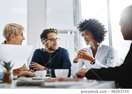 Success happens when a great team comes together. Shot of a group of businesspeople sitting together in a meeting. Success happens when a great team comes together. Shot of a group of businesspeople sitting together in a meeting. 96063734