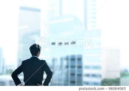 Office worker in a suit staring at the future Office worker in a suit staring at the future 96064065