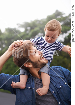 Fun times with Dad. Shot of young father and his baby boy enjoying a day outside. Fun times with Dad. Shot of young father and his baby boy enjoying a day outside. 96064263
