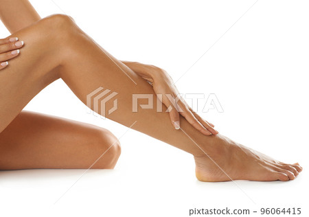 So soft and smooth. Studio shot of a young womans beautiful legs isolated on white. So soft and smooth. Studio shot of a young womans beautiful legs isolated on white. 96064415