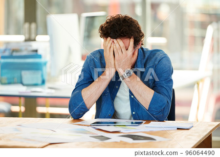 One of those days. Shot a frustrated designer sitting at his desk. 96064490