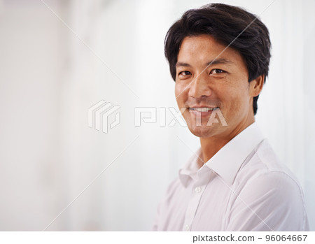 Hes got what it takes to be a leader. Portrait of a handsome businessman smiling at the camera. 96064667