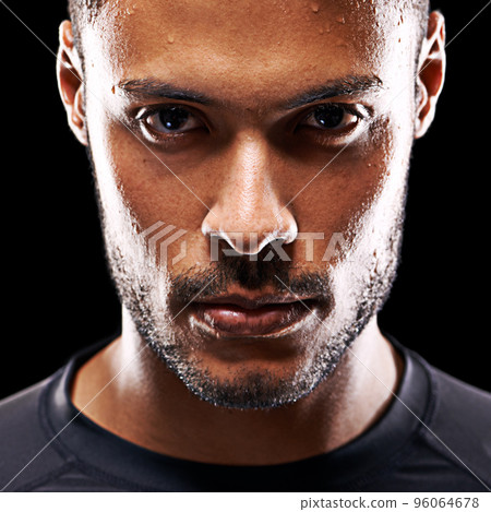 Losing isnt an option. Studio shot of a fit young man isolated on black. 96064678