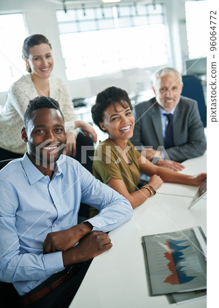 Its been a great day at the office. Portrait of a group of coworkers sitting together in an office. 96064772
