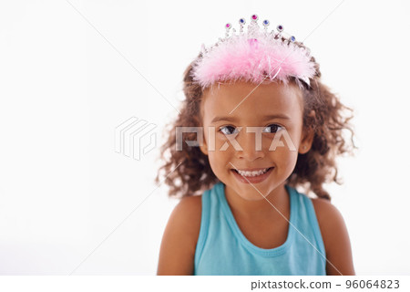Shes just a little princess. Studio portrait of an adorable little girl in a tiara isolated on white. 96064823