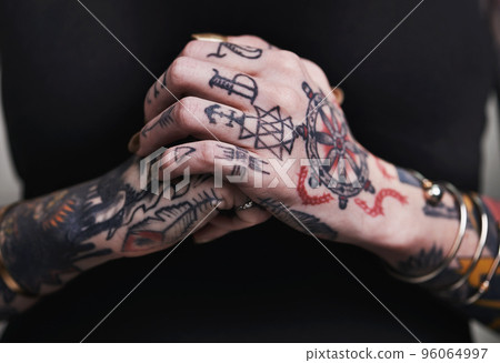 My journey, my tattoo. A cropped shot of tattooed hands. 96064997