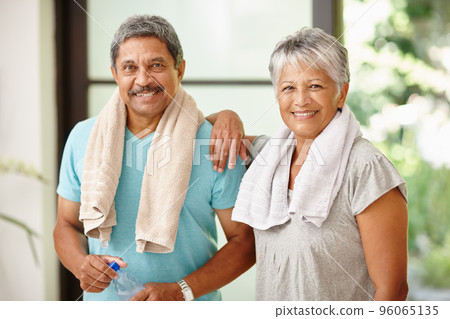 We look good and feel great. Portrait of a mature couple taking a break from exercising. We look good and feel great. Portrait of a mature couple taking a break from exercising. 96065135