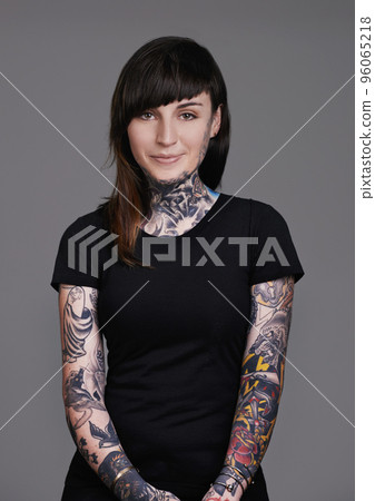 Let your beauty rise to the surface. A cropped studio portrait of a beautiful tattooed young woman. Let your beauty rise to the surface. A cropped studio portrait of a beautiful tattooed young woman. 96065218