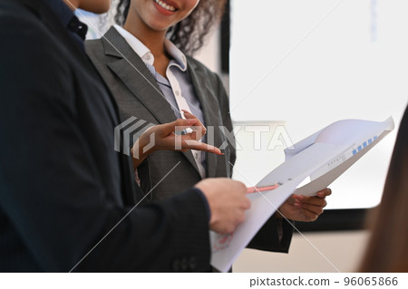 Cropped shot of executive manager discussing business plan with her coworker at board room meeting Cropped shot of executive manager discussing business plan with her coworker at board room meeting 96065866