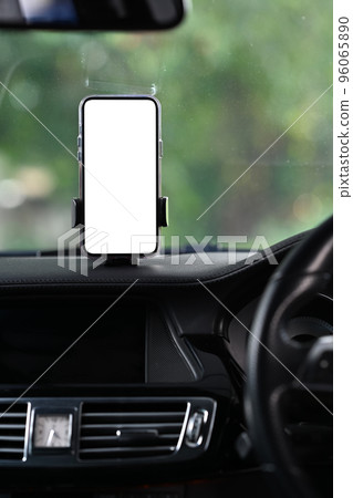 Smart phone with blank screen in car windshield holder. Empty screen for your advertise design 96065890
