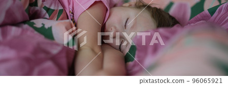 Little girl kid sleeping sweetly in bed 96065921