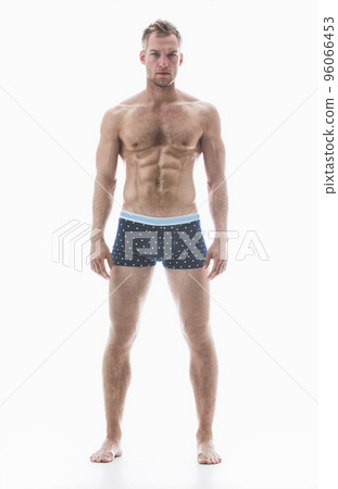 Perfect abs AND body. Studio shot of a male model in underwear isolated on white. 96066453