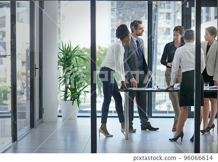 This is where profits are born. Shot of a group of businesspeople having a serious discussion in the boardroom. This is where profits are born. Shot of a group of businesspeople having a serious discussion in the boardroom. 96066614