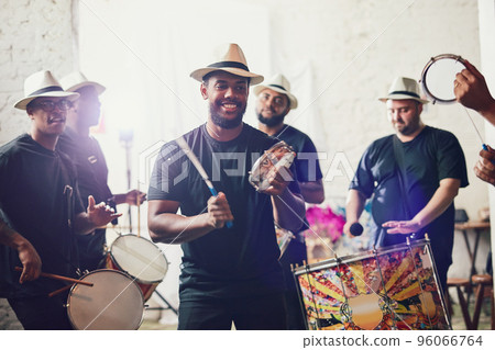 Their beats bring so much energy into the room. Shot of a group of musical performers playing drums together. Their beats bring so much energy into the room. Shot of a group of musical performers playing drums together. 96066764