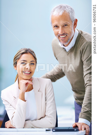Dynamic no matter what age. Portrait of a young businesswoman and a a mature businessman in an office. 96066781