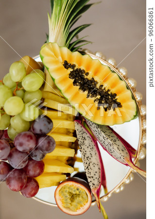 A variety of exotic fruits on a festive table for a banquet. A variety of exotic fruits on a festive table for a banquet. 96066861