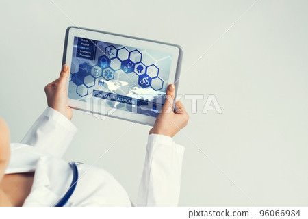 Close of female doctor hands working with tablet pc computer Close of female doctor hands working with tablet pc computer 96066984