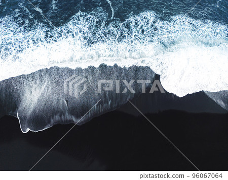 Waves crashing on the black beach in Iceland Waves crashing on the black beach in Iceland 96067064