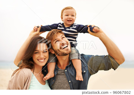 Find what brings you joy and go there. Cropped shot of a young couple and their son at the beach. Find what brings you joy and go there. Cropped shot of a young couple and their son at the beach. 96067802
