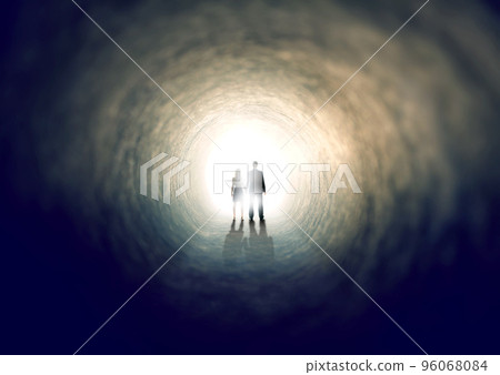 Finding the light. A shot of two people finding an exit from a dark tunnel - ALL design on this image is created from scratch by Yuri Arcurs team of professionals for this particular photo shoot. 96068084