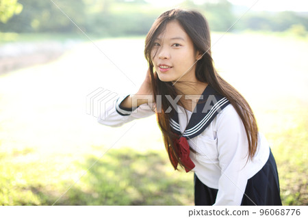 Asian school girl with countryside background Asian school girl with countryside background 96068776