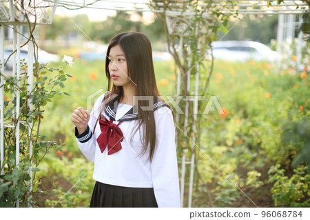 school girl costume at park outdoor with flowers garden background 96068784
