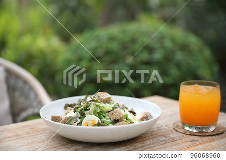 caesar salad appetizer on wooden background 96068960