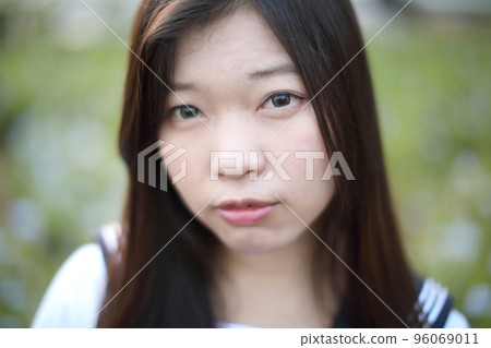 school girl costume at park outdoor with flowers garden background 96069011