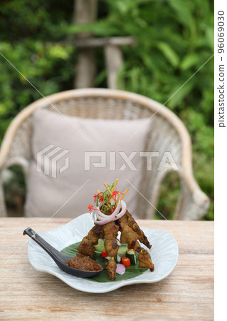 Chicken Satay on dark brown table street food appetizer Chicken Satay on dark brown table street food appetizer 96069030