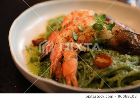 spaghetti pesto sauce with grilled shrimps italian food spaghetti pesto sauce with grilled shrimps italian food 96069108