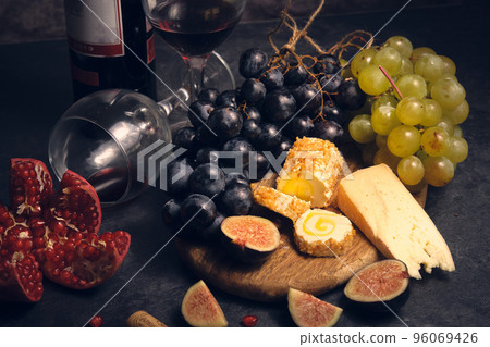 still life wine different cheeses and fruits 96069426