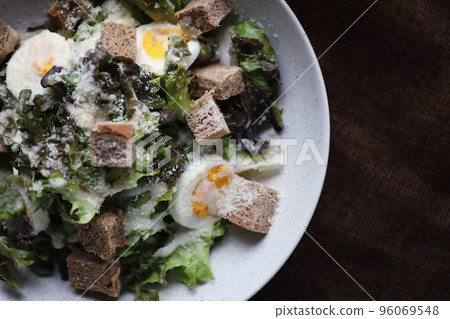caesar salad appetizer on wooden background caesar salad appetizer on wooden background 96069548