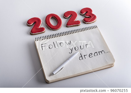 Numbers 2023 and notebook with words 96070255