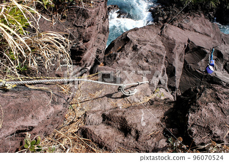 Standing on the tip of the shore and fishing for porgies Standing on the tip of the shore and fishing for porgies 96070524