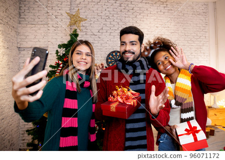 Group young friends taking selfie with excited and enjoy with smart phone together at home. Group young friends taking selfie with excited and enjoy with smart phone together at home. 96071172