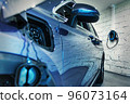 charging station of a modern electric car. The back of the electric crossover. Type 2 Euro connector. 96073164
