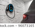The blue charging station of a modern electric car. The back of the electric crossover. Type 2 connector 96073165