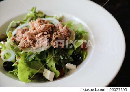 Tuna salad appetizer on wood background Tuna salad appetizer on wood background 96075595