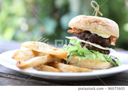 Beef Hamburger on wood background Beef Hamburger on wood background 96075605