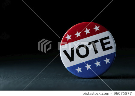 vote badge for the US election on a gray surface vote badge for the US election on a gray surface 96075877