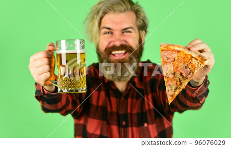 Pizza is better when shared. Pizzeria restaurant. Gourmet food. Cheerful man bearded hipster hold pizza. Hungry man going to eat pizza and drink beer. Perfect rest in pub. Finally pizza time 96076029