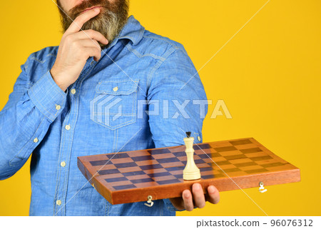 Board game. level up your iq. bearded man hold chess board. intelligence quotient concept. human brain working. brainstorming concept. play chess tournament. Intelligence level measurement Board game. level up your iq. bearded man hold chess board. intelligence quotient concept. human brain working. brainstorming concept. play chess tournament. Intelligence level measurement 96076312