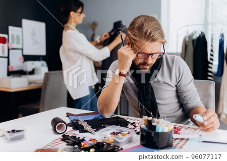 People desinging cloothes at workplace 96077117